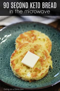 two pieces of bread on a blue plate with butter and some text overlay that reads, 90 second keto bread in the microwave