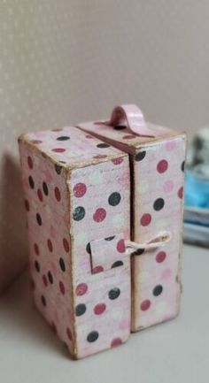 a small pink box with polka dots on it