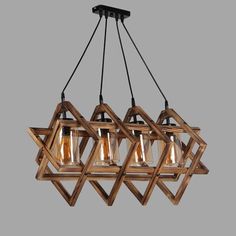 a wooden chandelier with five light bulbs hanging from the ceiling, and three lights on