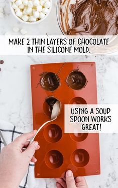 someone is decorating some chocolates with spoons