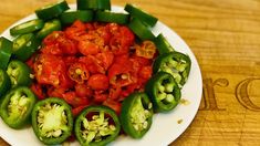 green peppers and tomatoes on a white plate