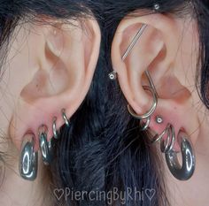 an ear with two different piercings attached to it