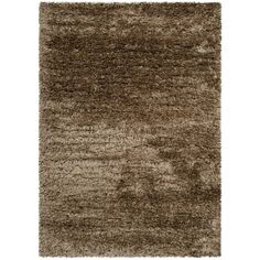 a shaggy rug with brown and white colors on the bottom, it is very soft