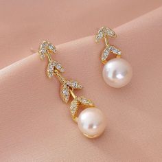 📣 All in stock products will quickly ship by USPS Priority Mail. Made to order products please allow 5-10 days to ship out.💕 Welcome to JulyAccessories. Every product here is done by myself. -Created and crafted by me with 14K gold plated, 925 silver stud, and natural pearl. -Anti-allergic Lasting Color Retention. -High-quality, Non-damaging. -Fashion and luxury. If you love my shop, please favorite my shop or items. The new items will be uploaded every week! Special Reminding -Do not wash -Do Elegant Gold Earrings For Bridesmaids, Gold Pearl Earrings For Bridesmaid Gift, Elegant Gold-tone Pearl Earrings, Gold-tone Pearl Drop Earrings For Party, Luxury Gold-plated Pearl Drop Bridal Earrings, Luxury Gold-plated Pearl Earrings For Evening, Bridesmaid Pearl Earrings, Pearl Earrings Wedding, Gold Bridal Earrings