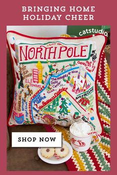 the north pole pillow is on display with other items