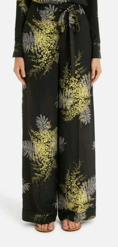 VALENTINO Mimosa Print Silk Wide Leg Pants, Size 38( US 2), $1980.00, NWT. Silk pants are brand new, and in perfect condition. They will come with tags attached, and wrapped in plastic. SIZE INFO True to size. High rise. DETAILS & CARE Bright mimosa flowers signal a fresh season for these silk crêpe de Chine pants tailored with a relaxed wide-leg silhouette and waist-defining tie belt. Zip fly with tie closure Front slant pockets; back button-welt pockets 100% silk Dry clean Made in Italy Item #