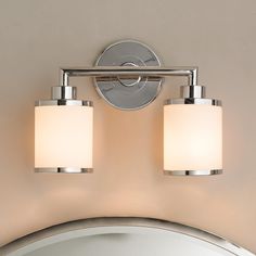 two light bathroom fixture in chrome finish with white glass shades on the top and bottom