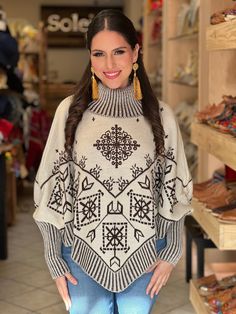 This gorgeous Mexican Artisanal Poncho is perfect for the cold months ahead! The thick sweater material and long sleeves will keep you warm all winter long. The turtle neck and fair isle design adds that perfect pop of color and style to your wardrobe. This poncho is knit, has open sides and it comes in one size so anyone ranging from size Small to 2x will be able to wear it. Bohemian Shawl Sweater In Knit, Bohemian Knit Shawl Sweater, Bohemian Shawl Knit Sweater, Long Sleeve Poncho For Cold Weather In Fall, Bohemian Long Sleeve Jacquard Knit Sweater, Winter Poncho Cape In Knit, Winter Knit Poncho Cape, Winter Knit Cape Poncho, Knitted Shawl Sweater