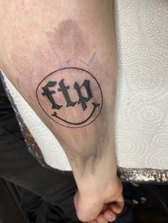 a person with a tattoo on their leg that has the word fu written in it