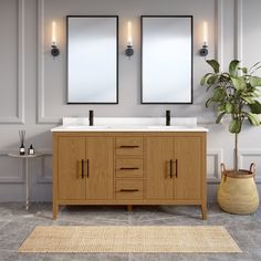 a bathroom with two mirrors above the sinks and a rug on the floor next to it