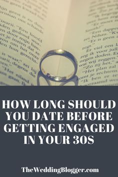 a wedding ring sitting on top of an open book with the title how long should you date before getting engaged in your 30's?