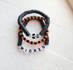 If you love Halloween, you will love this set of bracelets! These bracelets are great for girls, boys, women and men! Skeleton bead on one and customize another with any name or word you want! Get your hands on these bracelets this season before they are gone! How to order 1) Select a size 2) Select a style 3) Add to cart and purchase Handmade with love and care Diy Halloween Bracelets, Hhn Bracelets, Bracelets Halloween, Cheer Ribbon