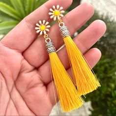 Yellow Flower Tassel Earrings For Sale! These Earrings Are So Cute! They Are New, They Are Handmade, And They Are From My Boutique! They Feature A Yellow And White Flower With Yellow Tassels Dangling From Them, And They Are Made For Pierced Ears. They Are About 4 Inches Long. Such A Great Earrings To Add To Your Jewelry Collection! Handmade Yellow Earrings For Spring, Yellow Bohemian Adjustable Tassel Earrings, Adjustable Yellow Bohemian Tassel Earrings, Yellow Bohemian Tassel Earrings, Gold Bohemian Tassel Earrings For Spring, Bohemian Yellow Adjustable Tassel Earrings, Yellow Flower Charm Earrings For Spring, Gold Dangle Tassel Earrings For Spring, Gold Tassel Drop Earrings For Spring