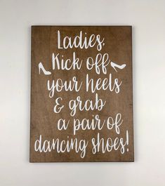 a wooden sign that says ladies kick off your heels and grab a pair of dancing shoes