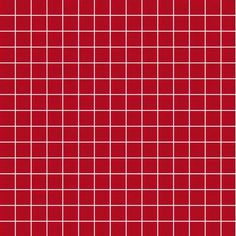 a red tile wall with white squares on it