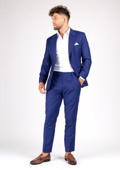 A distinct and striking look, the Ellis Royal Blue Twill suit is custom made for those who want to make a statement. The vibrant color features a subtle hint of purple for a bold look. Exude confidence in royal blue. Classic Royal Blue Tuxedo With Notch Lapel, Blue Fitted Suit In Suiting Fabric, Fitted Blue Suit In Suiting Fabric, Slim Fit Blue Suits For Workwear, Slim Fit Blue Suit For Work, Royal Blue Notch Lapel Suits For Work, Blue Fitted Suit For Work, Blue Slim Fit Suit In Suiting Fabric, Blue Slim Fit Suits In Suiting Fabric