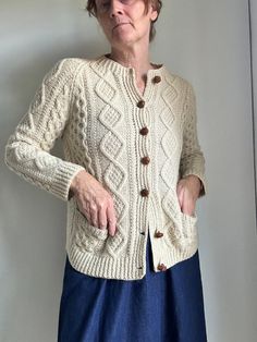 Vintage Wool Fisheman's Cardigan Sweater Neutral Size Small Classic Coastal Handmade Front pocket Handmade Leather buttons Cream Slightly itchy Pre-owned no flaws Measures Flat Bust 22" Length 24" Sleeves 22"  #fishermanknits #cardigans #irishsweaters #coastalwool #woolsweaters #sweaters #jumper #beachy #handknitsweaters #handmade #handknit 1.8 o MY24 CLST Classic Hand Knitted Outerwear For Fall, Casual Hand Knitted Beige Outerwear, Cream Knitted Outerwear For Fall, Fall Cream Knitted Outerwear, Classic Hand Knitted Fall Outerwear, Cream Knitted Long Sleeve Outerwear, Cream Knit Outerwear, Cream Long Sleeve Knitted Outerwear, Classic Hand-knitted Outerwear For Fall