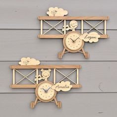 two wooden wall clocks with personalized faces on them