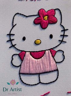 the hello kitty is wearing a pink dress