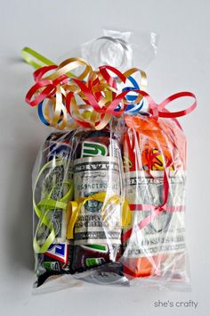 a bag filled with money and ribbons