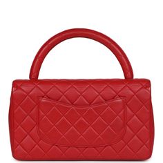 This Vintage Kelly Parent Flap Bag is in red lambskin leather with silver hardware, featuring the signature CC turnlock closure with front flap, half moon back pocket and a red single rolled top handle. The interior is lined in red leather and includes one zip pocket with logo pull and a slip pocket underneath on the rear wall. Collection: 4-series (1996-1997)Origin: FranceCondition: Vintage; Excellent to Mint- This bag retains its shape. No visible scratching to turnlock hardware. Minor press m Chanel Kelly, Vintage Kelly, Vintage Chanel, Fendi Bags, Flap Bag, Lambskin Leather, Handbag Backpack, Half Moon, Silver Hardware