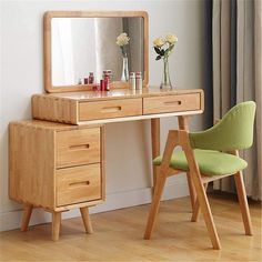 a wooden desk with a mirror and two chairs