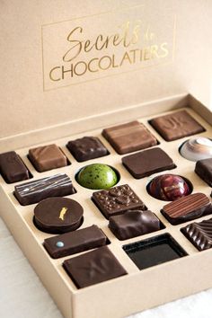 a box filled with lots of different types of chocolates