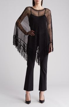 Chevrons of geometrically shaped stitching further enrich this generously fringed Italian-knit silk poncho. 38" length (size Small) Boat neck 100% silk Dry clean Made in Italy Designer Clothing Long Sleeve Fringe Poncho, Fringed Long Sleeve Poncho For Fall, Winter Cape With Tassels, Long Sleeve Fringe Poncho For Fall, Fringe Long Sleeve Poncho For Fall, Bohemian Knit Poncho With Fringe, Spring Poncho With Tassels, Spring Poncho With Tassels One Size, One Size Tassel Poncho For Spring