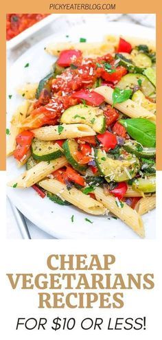 a white plate topped with pasta and vegetables