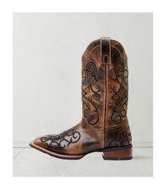 Step into elegance and comfort with the Women's Margo Western Boots. Featuring a broad square toe design, these boots are the perfect combination of rustic charm and contemporary style, making them a must-have for any cowgirl's wardrobe. Constructed with a durable leather upper, the Margo boots promise both quality and longevity. The rubber outsole ensures reliable traction, making them suitable for a variety of terrains. The pull-on style with handy pull tabs allows for easy wearing, providing Country Style Fitted Boots With Square Toe, Country Style Fitted Square Toe Boots, Rustic Square Toe Boots For Rodeo, Rustic Square Toe Ranch Boots, Country Style Boots With Square Toe For Western-themed Events, Western Wide Calf Heeled Boots With Square Toe, Rustic Brown Boots With Square Toe, Western Mid-calf Boots With Square Toe And Reinforced Heel, Rustic Brown Square Toe Boots