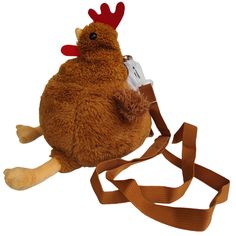 a stuffed chicken with a camera strap attached to it's back, on a white background