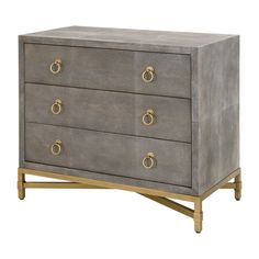 a grey and gold dresser with three drawers