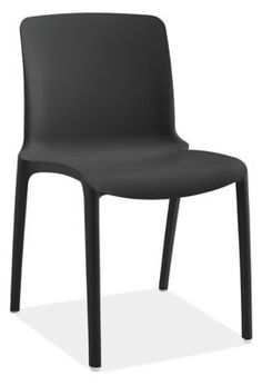 a black plastic chair sitting on top of a white floor