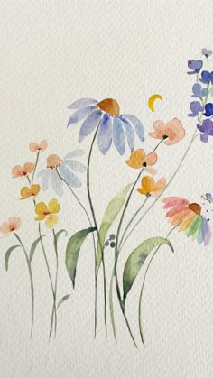 watercolor painting of colorful flowers on white paper