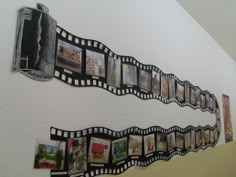 a wall with several pictures hanging on it's sides and some photos attached to the side