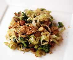 a white plate topped with broccoli and nuts