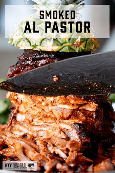 there is a large knife that is on top of some food and the words smoked al pastor