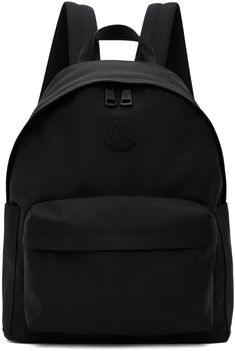 Water-repellent nylon canvas backpack in black. · Buffed leather trim throughout · Leather carry handle · Adjustable padded shoulder straps · Rubberized logo patch at face · Zip pocket at face · Patch pocket at sides · Two-way zip closure · Patch pocket at interior · Nylon taffeta lining · H16 x W13 x D6.5 Supplier color: Black Black Travel Bag With Logo Patch, Nylon Standard Backpack With Logo Patch, Nylon Logo Backpack, Logo Nylon Backpack, Nylon Backpack With Logo Patch, Black Standard Backpack With Logo Patch, Black Travel Backpack With Logo Patch, Nylon Backpack With Logo For Everyday Use, Black Backpack With Logo Patch