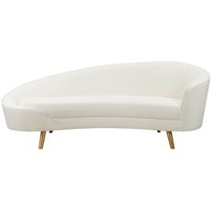 a white couch sitting on top of a wooden table