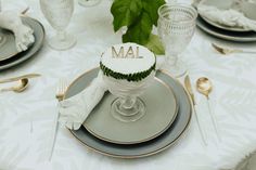 a table topped with plates and silverware