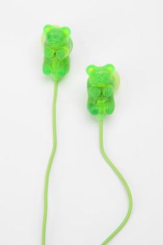 two green ear buds sitting next to each other