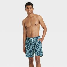 This 4-Way Stretch Elevated Elastic Waist Trunk Swimsuit from Goodfellow & Co™ feature a blue botanical-inspired motif pattern for an attractive look. Made from 4-way stretch, quick-drying fabric, these regular-fit swim trunks are designed with a built-in boxer for comfort in or out of water. A front drawstring on the elastic waist offers you a secure fit, while the UPF 50+ rated material helps keep you protected from the sun. Plus, the side and back pockets provide space to keep small essential Blue Bottoms With Built-in Shorts For Vacation, Casual Cotton Swim Trunks For Vacation, Relaxed Fit Bottoms With Pockets For Vacation, Casual Swim Trunks With Relaxed Fit For Vacation, Casual Relaxed Fit Swim Trunks For Vacation, Casual Relaxed Fit Short Swimwear, Blue Cotton Shorts For Vacation, Casual Blue Shorts For Warm Weather, Blue Vacation Shorts