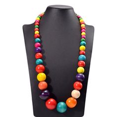 We are really happy to introduce you this Long Bohemian Necklace, Wooden Necklace, Colorful Necklace, Gift for Woman, Statement Necklace, Beaded Necklaces, Necklace for Women! This beautiful bohemian necklace is made of colorful wooden oval beads and dark-colored cotton rope. Its perimeter equals 42 cm, whereas its total weight is 105 g. The images attached match exactly the quality you will get once you have it around your neck. This necklace would not only put the finishing touch to your every Colorful Wooden Beads Jewelry As A Gift, Colorful Wooden Beads Jewelry For Gift, Colorful Wooden Beads Jewelry As Gift, Multicolor Large Beads Necklace For Gift, Multicolor Large Beaded Necklace For Gift, Multicolor Large Beads Necklace Gift, Colorful Wooden Beads Jewelry Gift, Colorful Adjustable Necklaces With Wooden Beads, Multicolor Wooden Beaded Necklaces As Gifts