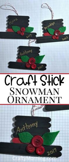 the craft stick snowman ornament is made from black paper and red buttons