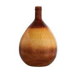 a brown vase sitting on top of a white surface