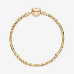 Take pride in your style with the Pandora Moments Heart Clasp Snake Chain Bracelet. Hand-finished in 14k gold, this design includes a heart-shaped clasp. Featuring our iconic snake chain, the bracelet has threaders and stoppers to keep your favorite charms in place. Wear this style on its own as a statement piece or team with contrasting chain link bracelets for a multilayered look with added texture. - Pandora Moments Heart Clasp Snake Chain Bracelet - 14k Gold - Sz. 7.9 in Elegant Yellow Gold Heart Bracelet With Beads, Elegant Yellow Gold Heart Beads Bracelet, Classic White Gold Heart Bracelets, Elegant Yellow Gold Bracelet With Heart Beads, Classic Heart Shaped White Gold Bracelet, Classic Gold Bracelets For Valentine's Day, Classic Heart Charm Bracelet In White Gold, Classic White Gold Charm Bracelet With Heart Charm, Classic Gold Heart Bracelet For Everyday