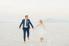 Utah Salt Flats Bridal Session, Utah photo locations, The Bonneville Salt Flats, Utah bridal photographer, Utah wedding photographer, Utah bridals, bridal inspiration. bride & groom, white wedding dress, wedding silver heels, wedding bouquet with greenery, groom in navy suit, Wedding inspiration, Epic photo locations Wedding Bouquet With Greenery, Silver Heels Wedding, Bouquet With Greenery, Utah Salt Flats, Utah Bridals, Salt Flats Utah, Navy Suit Wedding, Different Wedding Dresses, Bonneville Salt Flats