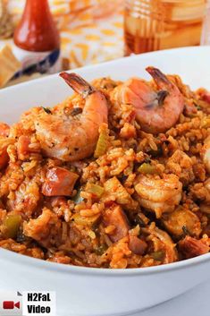 a white bowl filled with rice and shrimp