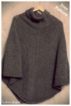 a gray sweater hanging on a hanger