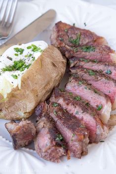 a plate with steak and potatoes on it